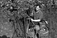 Eric Hosking sits in the frame of a bird hide with his High Speed Flash equipment used to photograph birds in flight, year 1948